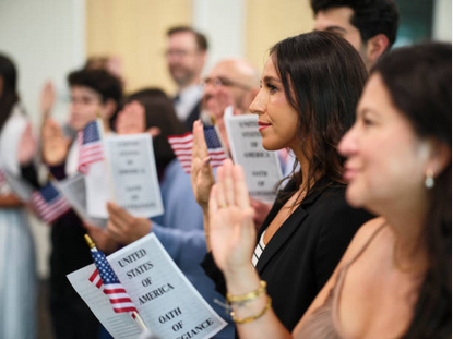 A group of immigrants swearing allegiance to the United States